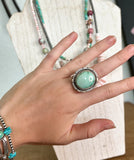 large turquoise and sterling silver ring. A western style turquoise ring worn with turquoise bracelets 